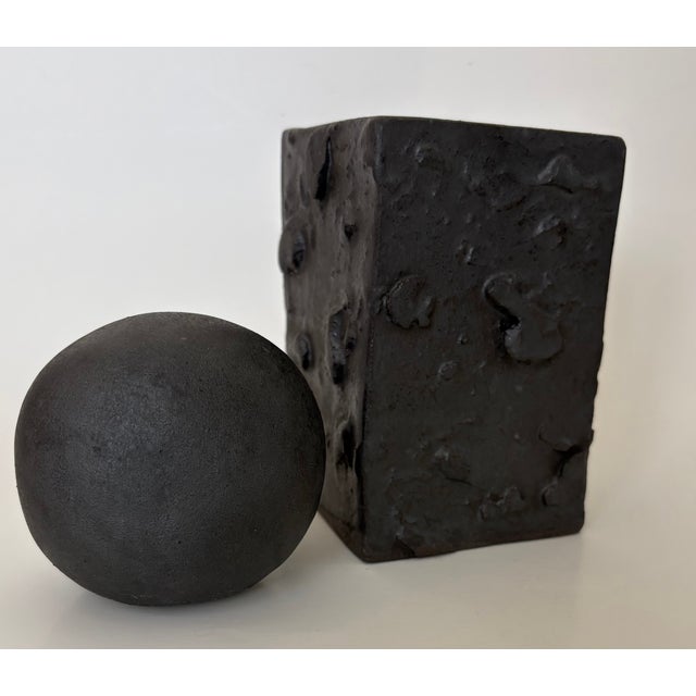This Matt Black Brutalist Ball and column Sculpture By GEO is in new condition. Measures 3 1/4W x 3 1/4D x 8 inches and...