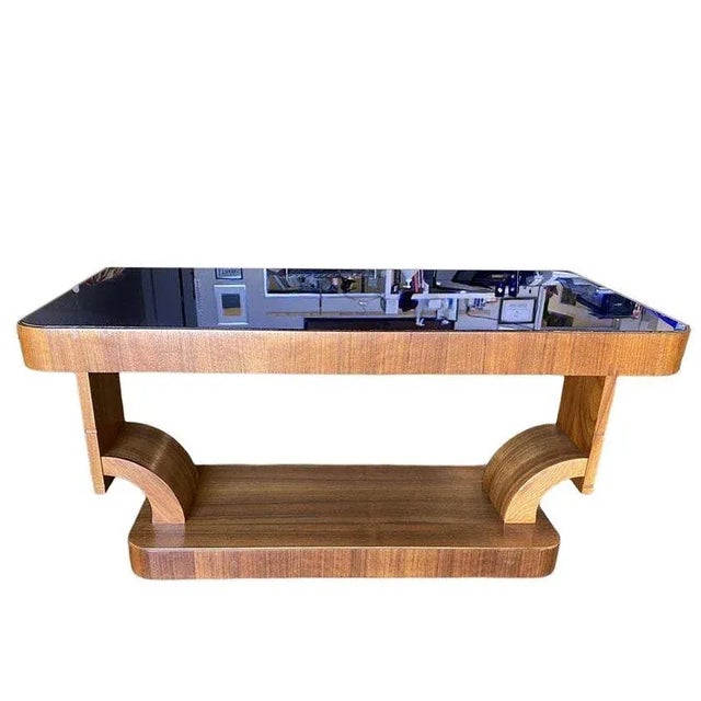 Gilbert Rohde Style Streamline Art Deco mahogany coffee table with cobalt glass top and a Modernist hourglass base. The...