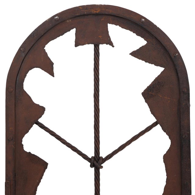 This pair of rustic arched panels features a gorgeous natural iron patina that exemplifies post-war Brutalism...