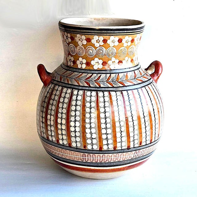 Offered is a vintage mid 20th Century 1960s large urn or planter made in Tonalá, Jalisco, Mexico, a province renowned for...