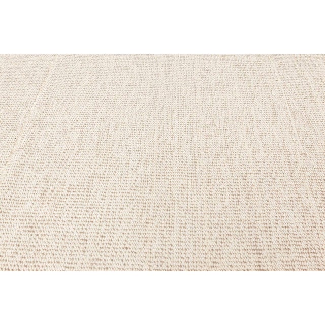 Contemporary sandy beige flat-woven wool Kilim rug by Doris Leslie Blau Size: 13'6" × 17'8" (411 × 538 cm) The carpet...
