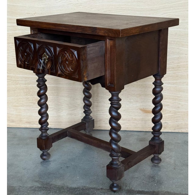 19th century pair of solid carved Spanish nightstands with Solomonic columns and carved drawers in dark ebonized wood.