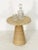 A fine Italian side or end table of travertine stone, featuring a circular top attached to a conical-shaped base in a...