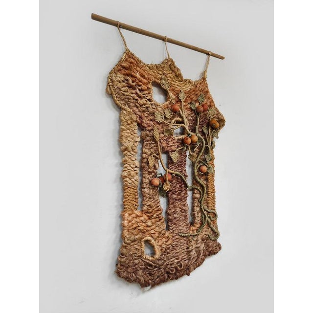 Get in touch with nature with this beautiful hand-knotted wall hanging from the 1960s. It's composed of various colors...