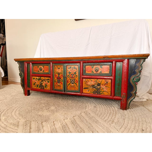 Hand-painted low kang cabinet from Inner Mongolia or the Gansu/Qinghai border region, early 20th century. Four drawers...