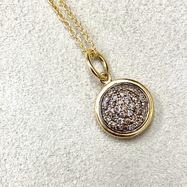 Created in 18 karat yellow gold 10 mm size charm Brown Diamonds 0.30 ct approx Chain sold separately This gorgeous 18...