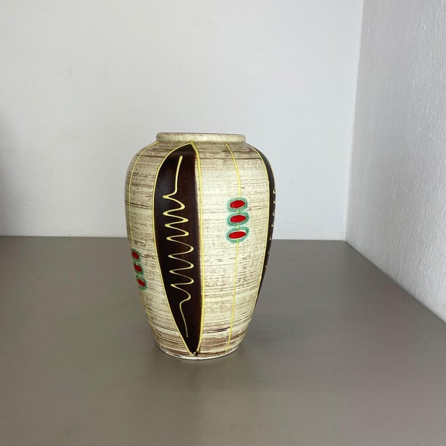 Original vintage 1950s pottery ceramic vase made in Germany. High quality German production with a nice abstract...