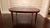 This is an oval dining table with a swirly crotch mahogany top made in the Leighton Hall shop in Suwanee, GA. It features...