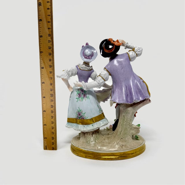 Elevate your collection with this exquisite hand-painted porcelain figurine from the renowned Sitzendorf factory in...