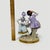 Elevate your collection with this exquisite hand-painted porcelain figurine from the renowned Sitzendorf factory in...