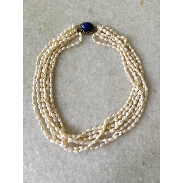 Gorgeous, vintage freshwater, pearl, multi strand necklace with silver and lapis clasp.