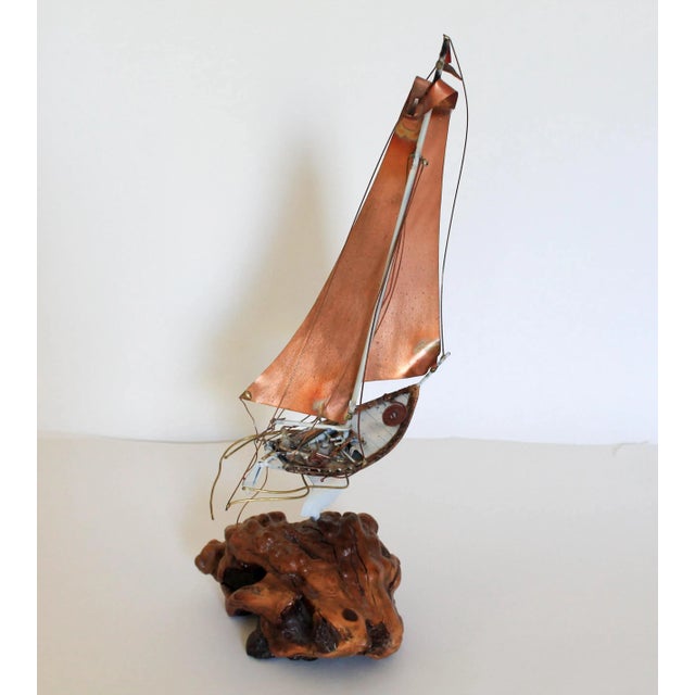 Mid-century brutalist copper sailboat with sailor and burlwood base. Very detailed. No makers mark.