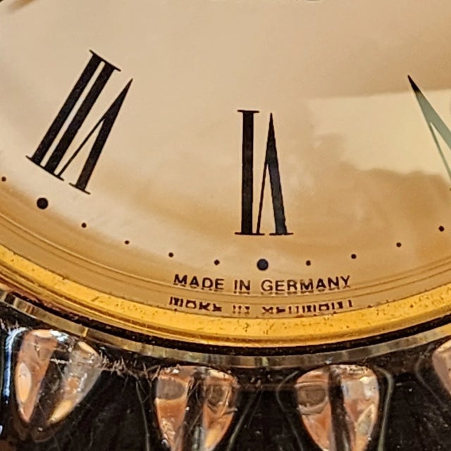 Add timeless sophistication to your space with this vintage Staiger quartz mantel clock, beautifully crafted in lead...