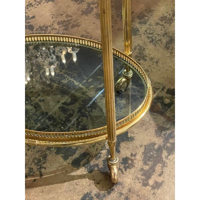 This vintage French brass bar cart is a stylish addition to any home or garden. With its classic design and sturdy...