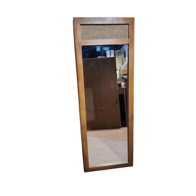 Beautiful mid century modern Dixie Furniture pecan and cane trumeau mirror in excellent condition. No damage or wear to...