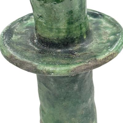 A Moroccan Tamegroute glazed candlestick holder is a handcrafted piece made in the historic pottery village of Tamegroute...