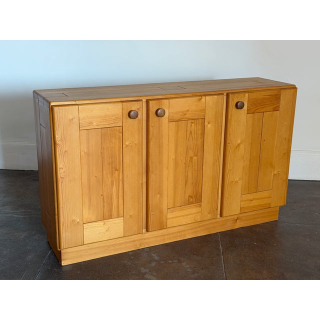 1970’s Charlotte Perriand solid pine credenza in good vintage condition. Unsigned. Dimensions 55” x 15” deep x 33” h