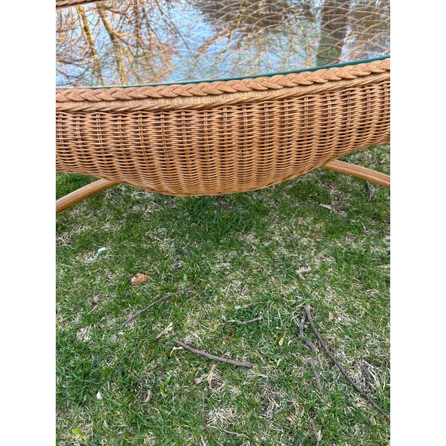 This boho chic wicker and glass table has a French flare from the 60’s. In great vintage condition.