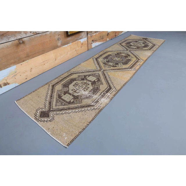 Vintage Turkish Hand-Knotted Runner Rug is a semi-Vintage runner rug. '70s Eastern region of Turkey's unique rug is...