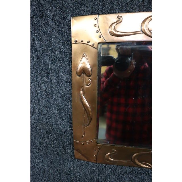 Arts & Crafts copper wall mirror with hanging hooks