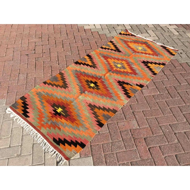 A beautiful vintage handwoven kilim. The kilim approximately 60 years old. It is handmade, of very fine quality in all...