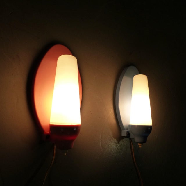 Set of 2 lovely wall lamps. Early plastic wall fastening/shade holders in pink and blue with white pressure switch, white...