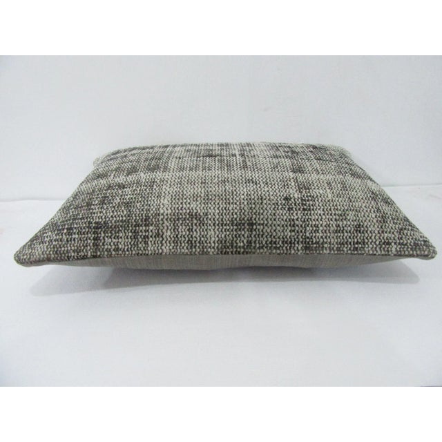 Decorative pillow cover made from a vintage Turkish handknotted rug. Backed with good quality cotton fabric. Pillow...