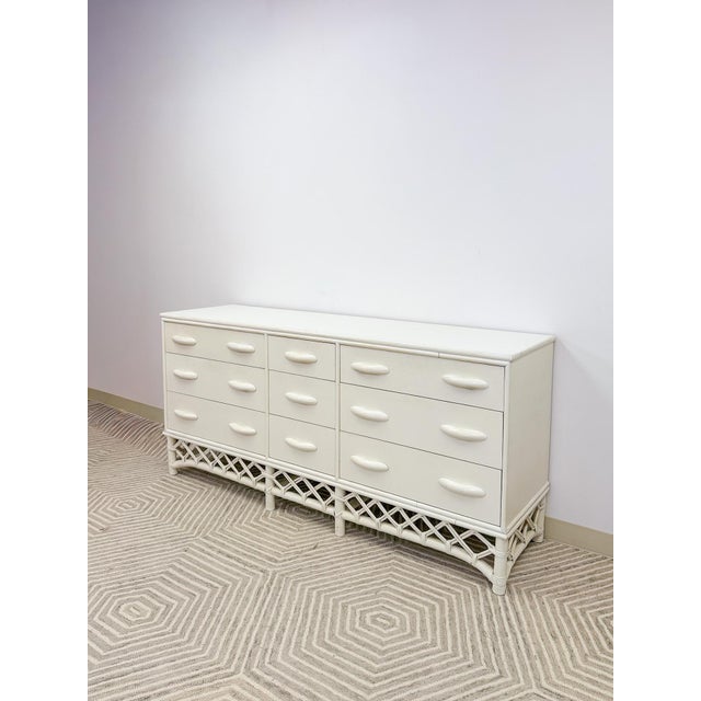 This gorgeous vintage white rattan 9-drawer dresser is a standout Old Florida and coastal decorative find. The crisp white...