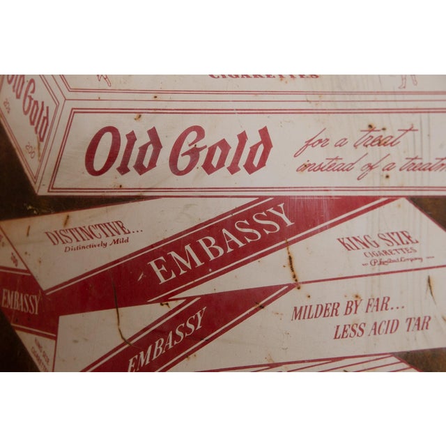 This antique hand-painted "Buy The Carton" sign originates from the early to mid-20th century, reflecting commercial...