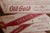 This antique hand-painted "Buy The Carton" sign originates from the early to mid-20th century, reflecting commercial...