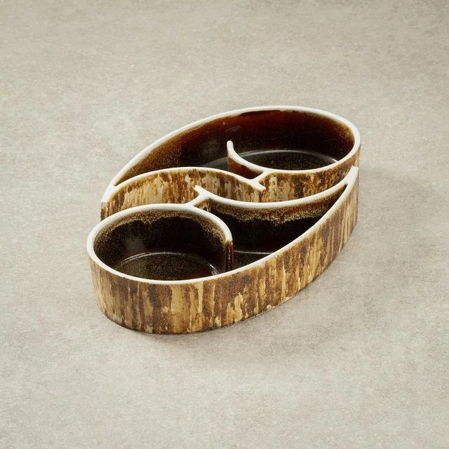 Yin and Yang are represented exquisitely in this pair of mid-century Suiban Ikebana Model 2045 vases. Designed and made by...