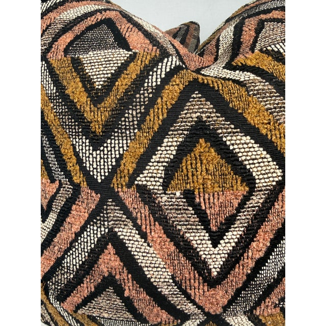 Custom pair of 22" pillows covered in a chenille fabric in a kuba cloth style pattern. These pillows have tapered corners...