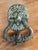 19th century English bronze door knocker cast as a lion mask with a full, flowing mane and beard on an oval backplate. The...