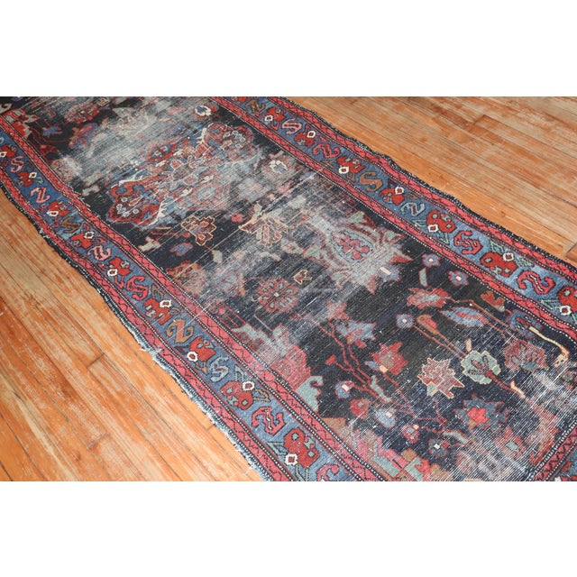 an early 20th - century worn persian runner Measure: 3'2'' x 9'11''.