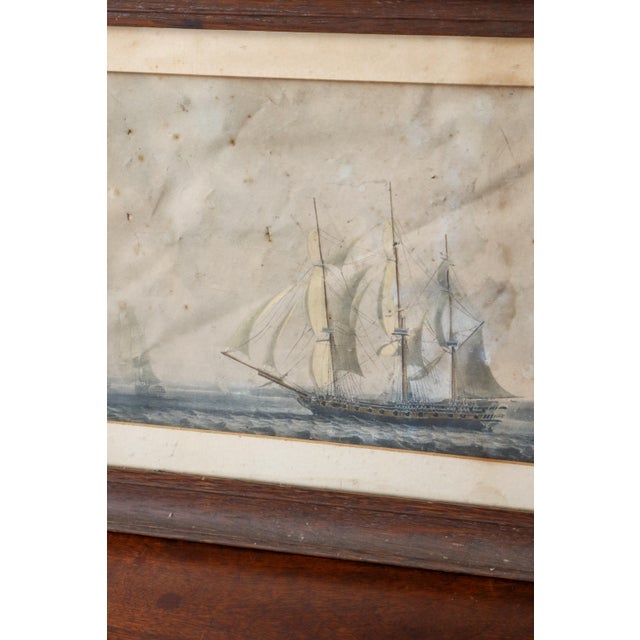 Antique maritime engraving depicting a sailing vessel at sea with finely detailed linework, period typography, and a solid...