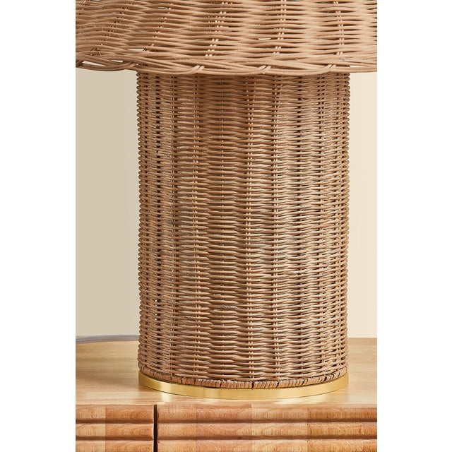 Woven from natural wicker, the Jeanette table lamp channels the inviting spirit of cottagecore with a bold, sculptural...
