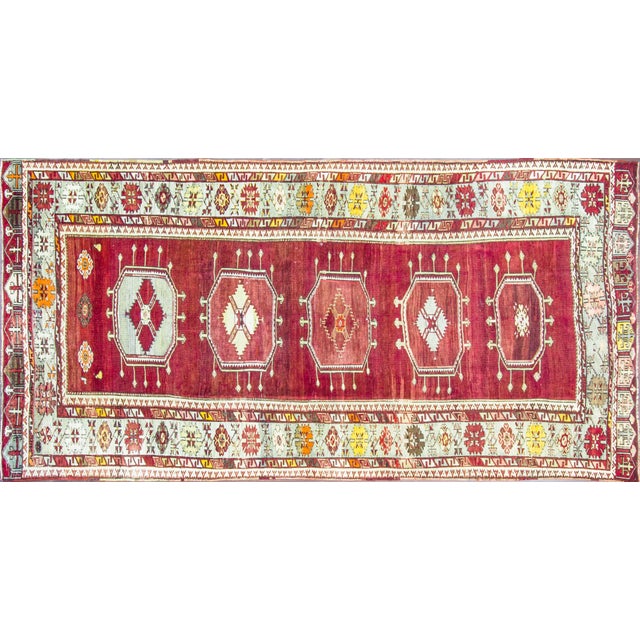 This is an authentic handmade rug. It was made in Turkey around the 1920s or before. It has very fine wool quality. An...