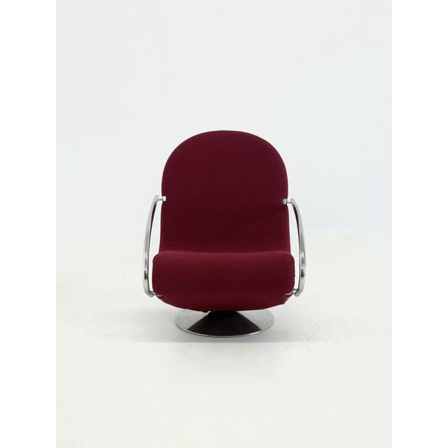 The 123 chair , designed by Verner Panton for Fritz Hansen , is a distinct icon within Scandinavian design. This armchair...