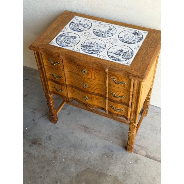 Danish oak side chest, attributed to Henning Kjærnulf, dating to the 1960s. The piece features a well-proportioned case...