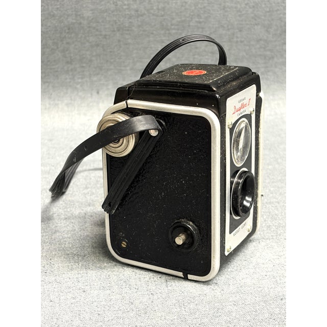 A vintage Kodak Duoflex II camera from the 1950s. This mid-century camera was made from 1946-1960. Known for its...