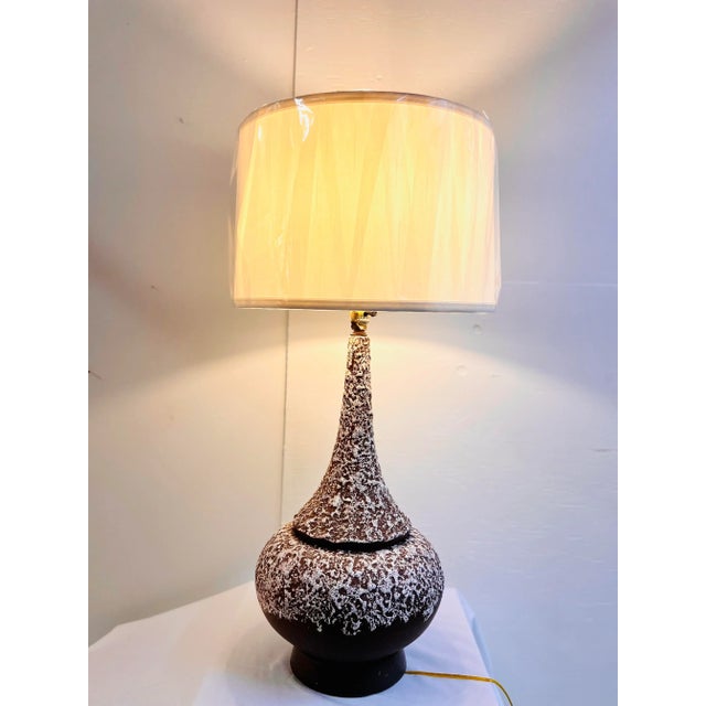 This is a marvelous mid-century treasure that is just waiting to be the centerpiece of your living room, office or parlor....