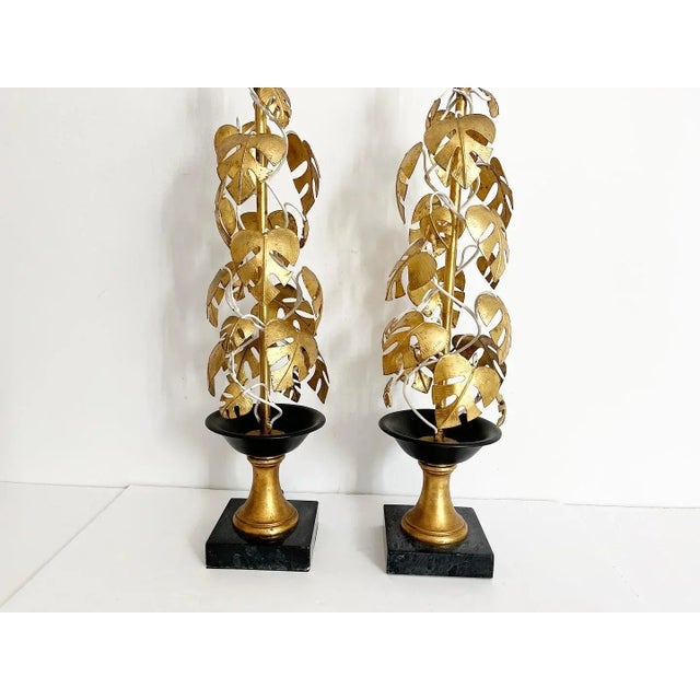 Magnificent, rare pair of statement-making mid century Italian topiary lamps featuring lifelike, twining gold gilt metal...