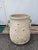 Antique terracotta jar/amphora/vase, handmade with leaf-shaped engravings and triangular and round slits. On the sides it...