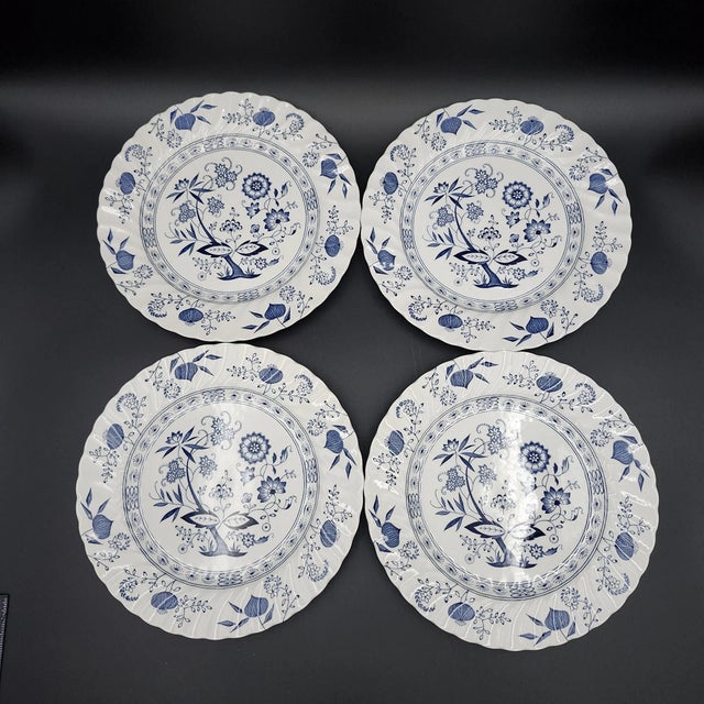 Bring classic English elegance to your table with this beautiful set of four Vintage Johnson Bros **Blue Nordic (Blue...