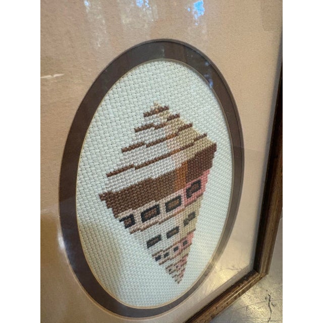 1970s framed needlepoint shell textile art. Excellent condition. Measures 10.5" x 8" including frame.