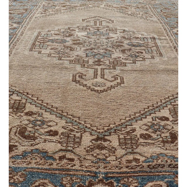 Persian Antique Hamadan small rug with Medallion Design in Tan, light Blue and brown accents. Keivan Woven Arts / rug...