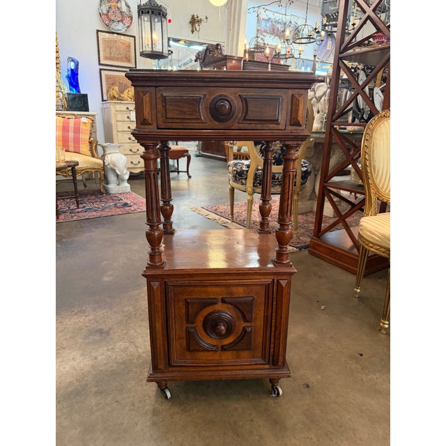 Resting on small brass wheel casters, this French Renaissance Revival servante or dumbwaiter table, is masterfully crafted...