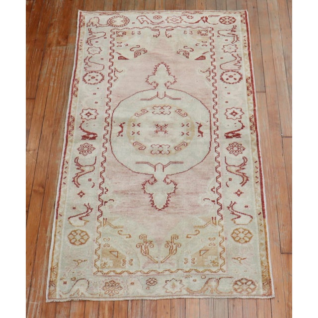 Mid 20th Century Turkish Oushak with a soft pink field, outlined in deep red Details rug no. 31522 size 3' 1" x 5' 8" (94...