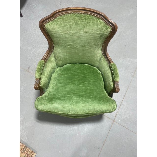 A medium size mahogany framed bergere upholstered in an emerald green velvet with a pink/red/green silk plaid used to...