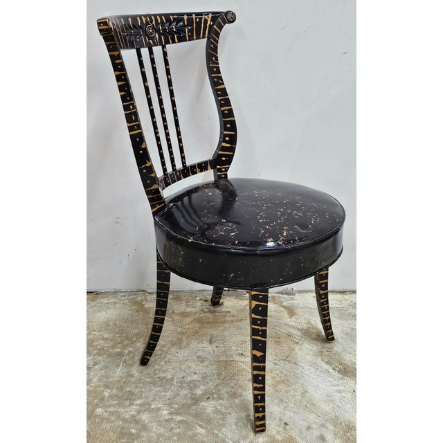A Neoclassical Ebonized and Partial Gilt Decorated Side Chair. A great piece of artwork. Firm springed seat with vinyl...